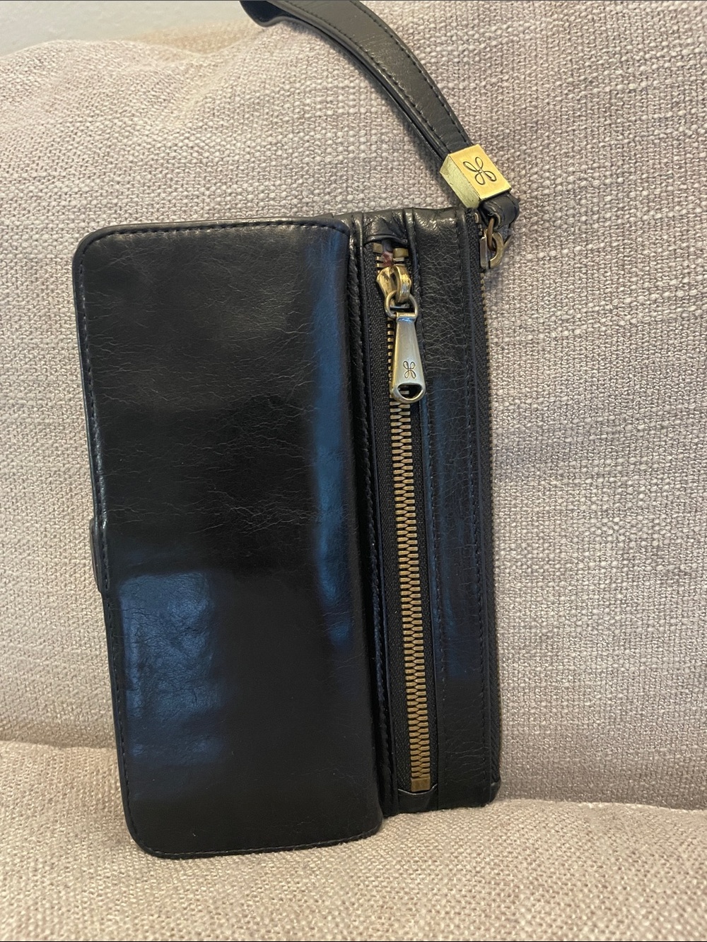 HOBO Black Wristlet with Gold Hardware and Orange Accents. 100% Genuine Leather.